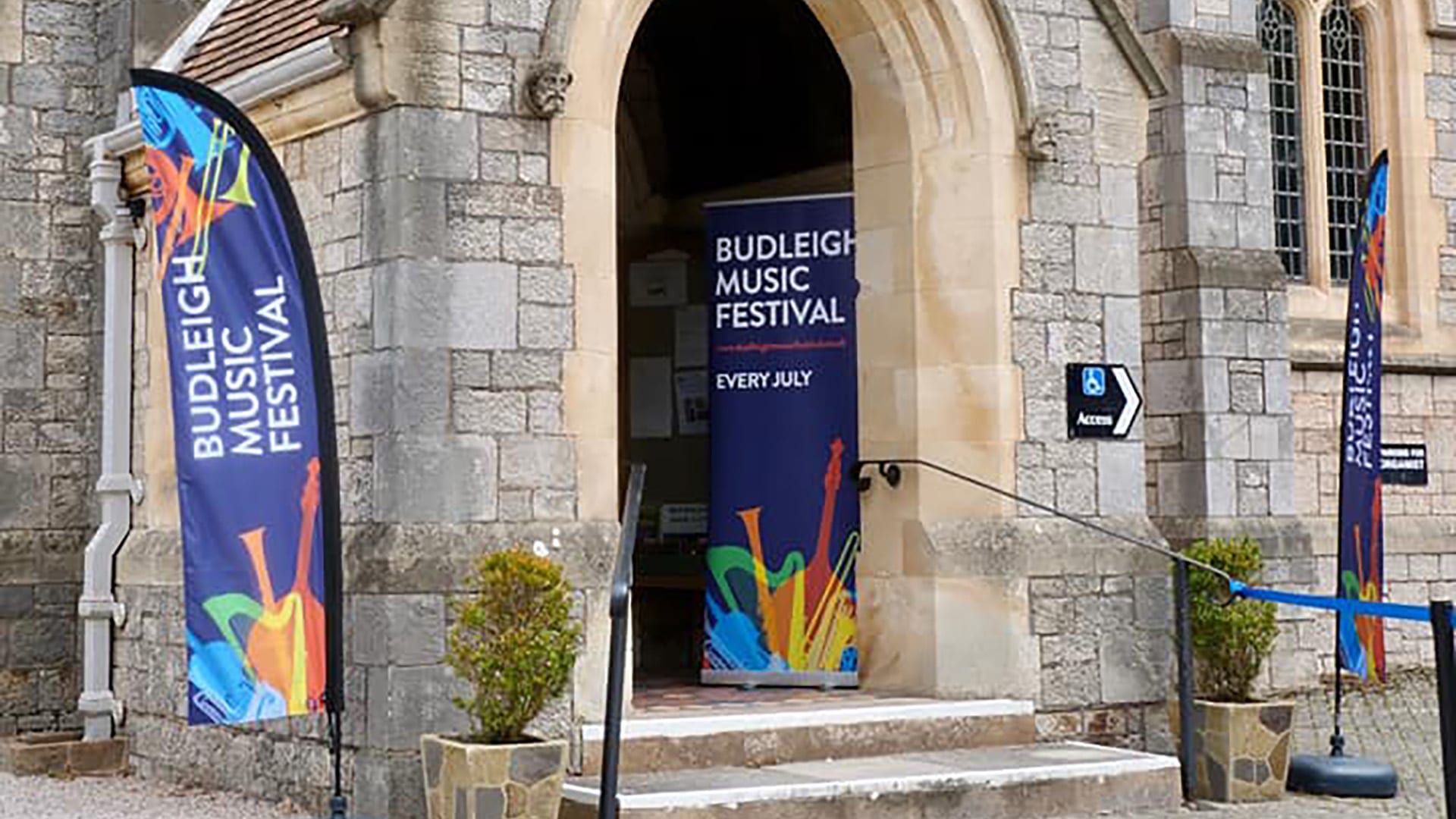 St Peter’s Church porch with Budleigh Music Festival signage.